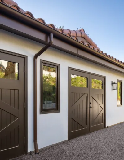 A house with two garage doors and a driveway.