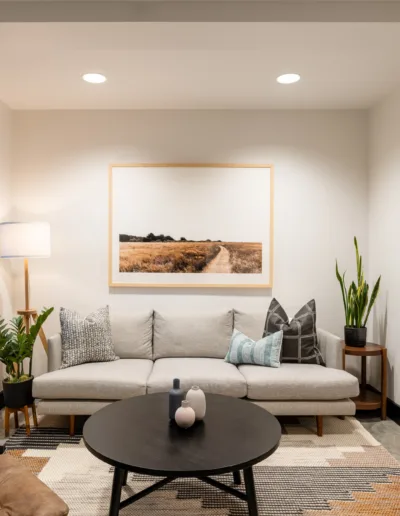 A living room with a couch and a coffee table.